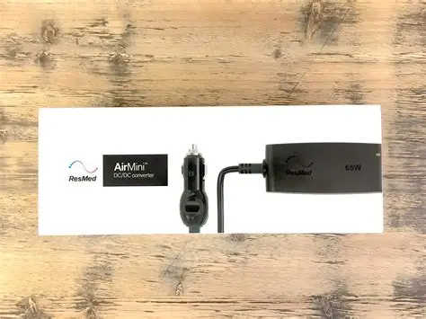 ResMed AirMini DC converter for portable CPAP power during travel or outdoor use.